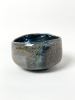 Blauer Stern2026, 7,5 x12 cm, wilder Ton, Slipglasur / wild clay, slip glazeHolzbrand ~ 1380°C, 65h / wood kiln fired&nbsp;Hier verwendeten wir lokalen wilden Lehmton der als Schlick aufgetragen wurde. Bei sehr hohen Temperaturen schmilzt dieser besondere Ton schwarz aus, entwickelt&nbsp; blau - weiße Kaskaden und schillernde, irisierende metallische Farben / Here we used local, wild clay, which was applied as a slip. At very high temperatures, this special clay melts to a black color, develops blue-white cascades, and shimmering, iridescent metallic colors.SOLD